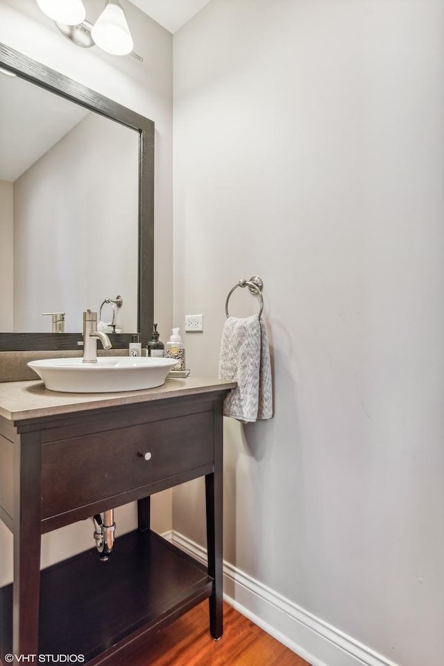 3019 W Cornelia Ave, Chicago, IL 60618 - bathroom with wood finished floors and vanity
