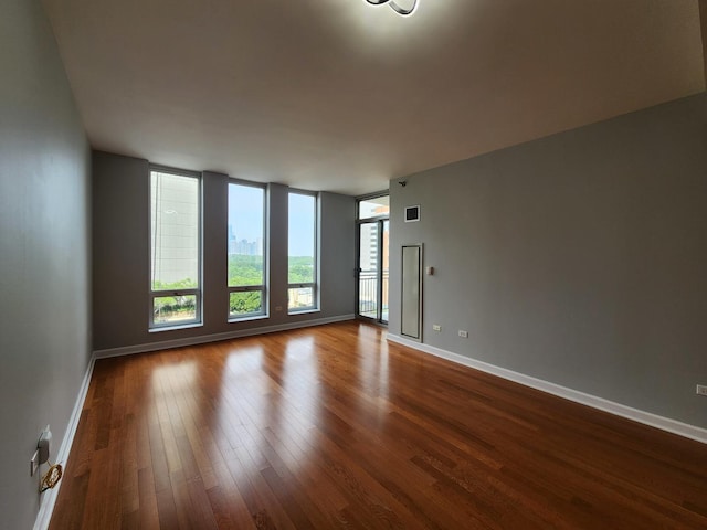 1250 S Michigan Ave Unit 703, Chicago, IL 60605 - spare room with dark wood-type flooring and baseboards