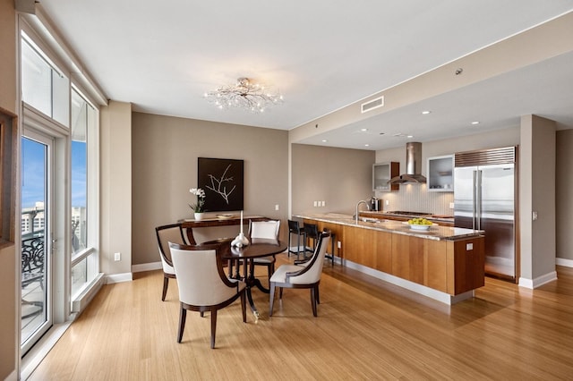 340 E Randolph St Unit 5504, Chicago, IL 60601 - dining space with healthy amount of natural light, light wood-style floors, a chandelier, and recessed lighting