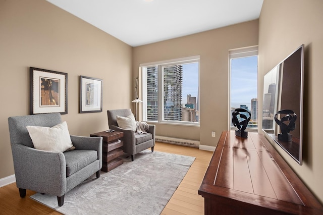 340 E Randolph St Unit 5504, Chicago, IL 60601 - sitting room featuring wood finished floors, a baseboard heating unit, and a view of city