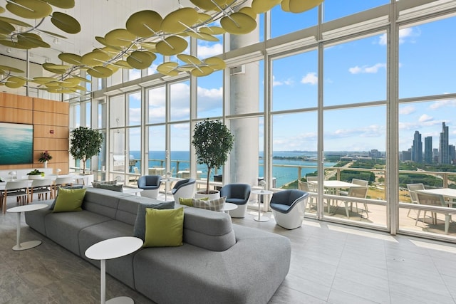 340 E Randolph St Unit 5504, Chicago, IL 60601 - living area featuring a towering ceiling, a wall of windows, a water view, and tile patterned floors