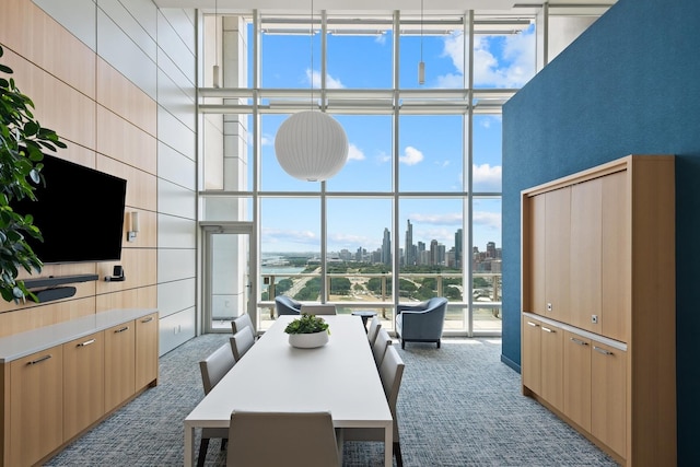 340 E Randolph St Unit 5504, Chicago, IL 60601 - carpeted dining area featuring a wall of windows, a towering ceiling, and a view of skyline