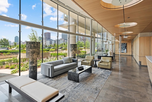 340 E Randolph St Unit 5504, Chicago, IL 60601 - community lobby featuring a view of skyline, a towering ceiling, wood ceiling, and a wall of windows