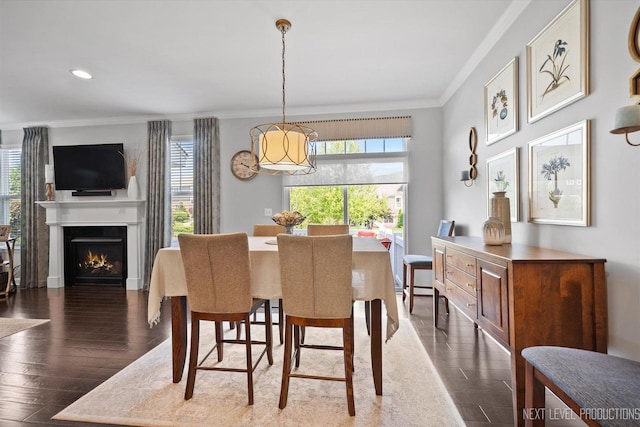 3S661 Breme Dr W, Warrenville, IL 60555 - dining room featuring crown molding, wood finished floors, a chandelier, recessed lighting, and a warm lit fireplace