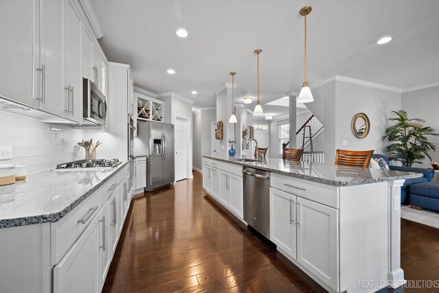 3S661 Breme Dr W, Warrenville, IL 60555 - kitchen with stainless steel appliances, crown molding, decorative backsplash, dark wood-style flooring, and white cabinets