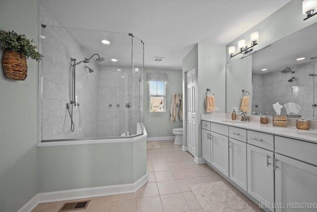 3S661 Breme Dr W, Warrenville, IL 60555 - full bathroom with vanity, a tile shower, tile patterned floors, and recessed lighting