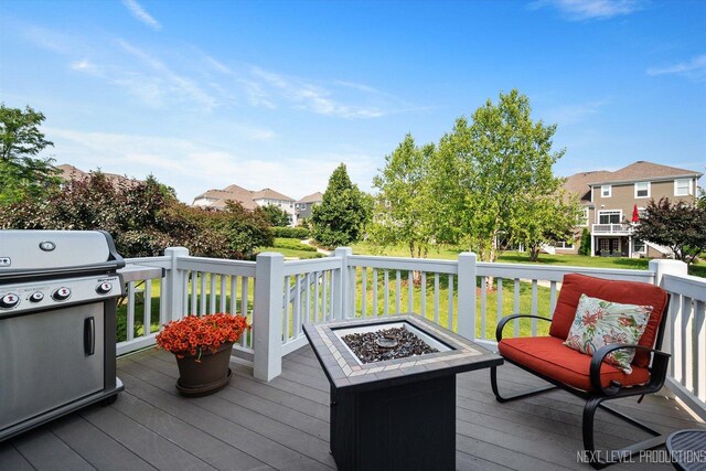 3S661 Breme Dr W, Warrenville, IL 60555 - deck with area for grilling, an outdoor fire pit, and a residential view