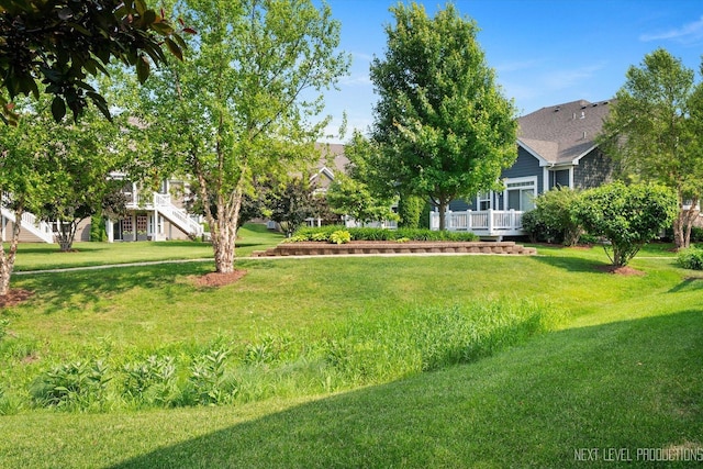 3S661 Breme Dr W, Warrenville, IL 60555 - view of green lawn featuring a deck