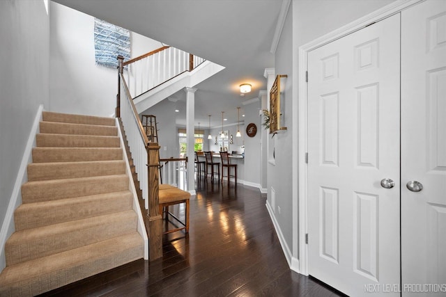 3S661 Breme Dr W, Warrenville, IL 60555 - staircase with wood finished floors, ornamental molding, and decorative columns