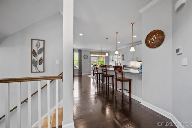 3S661 Breme Dr W, Warrenville, IL 60555 - kitchen with a kitchen bar, white cabinets, recessed lighting, dark wood-style flooring, and pendant lighting