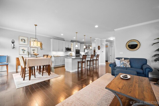 3S661 Breme Dr W, Warrenville, IL 60555 - living area featuring crown molding, dark wood-style flooring, and recessed lighting