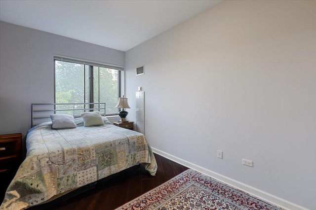 1322 S Prairie Ave Unit 406, Chicago, IL 60605 - bedroom featuring baseboards and dark wood finished floors