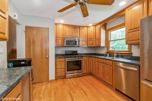 25W251 Highview Dr, Naperville, IL 60563 - kitchen featuring stainless steel appliances, dark countertops, light wood-style floors, a ceiling fan, and recessed lighting