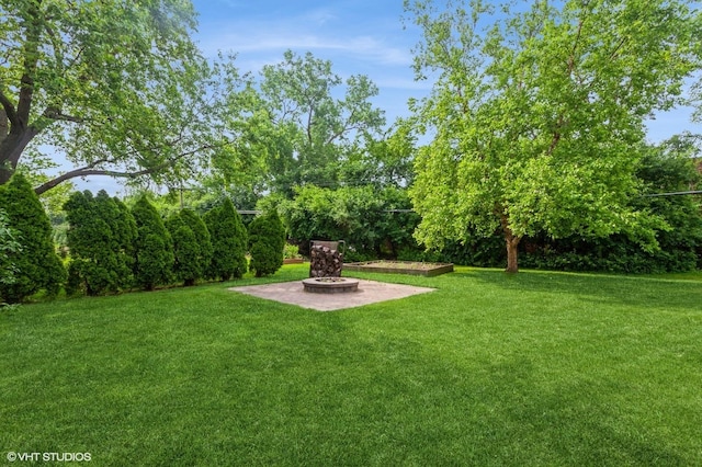25W251 Highview Dr, Naperville, IL 60563 - view of green lawn featuring a fire pit and a patio