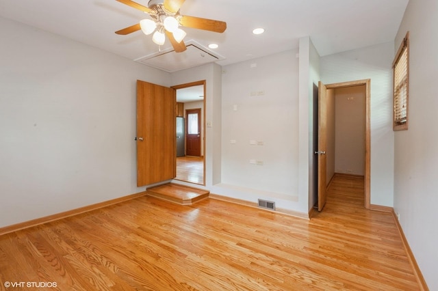 25W251 Highview Dr, Naperville, IL 60563 - spare room featuring attic access, light wood-style floors, a ceiling fan, and recessed lighting