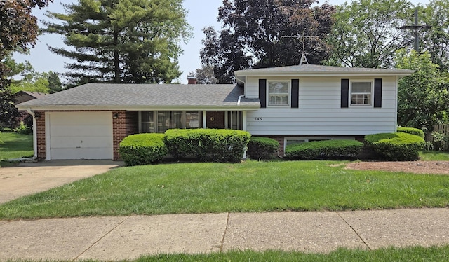 549 E Lincoln St, Palatine, IL 60074 - split level home with a garage, brick siding, driveway, and a front lawn