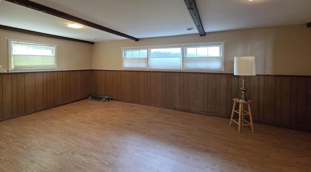 549 E Lincoln St, Palatine, IL 60074 - empty room with beamed ceiling, wainscoting, light wood-style flooring, healthy amount of natural light, and wooden walls