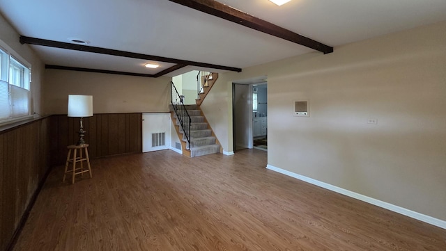 549 E Lincoln St, Palatine, IL 60074 - unfurnished living room with beam ceiling, stairway, wood finished floors, and a wainscoted wall