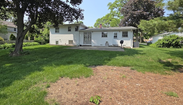 549 E Lincoln St, Palatine, IL 60074 - back of property with a patio and a lawn