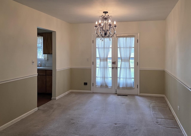 549 E Lincoln St, Palatine, IL 60074 - unfurnished dining area featuring carpet flooring, a chandelier, and french doors