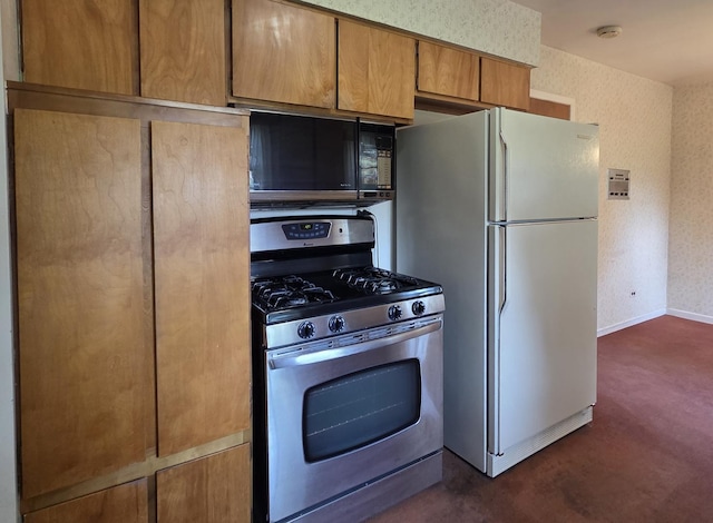 549 E Lincoln St, Palatine, IL 60074 - kitchen with stainless steel gas stove, black microwave, freestanding refrigerator, dark carpet, and wallpapered walls