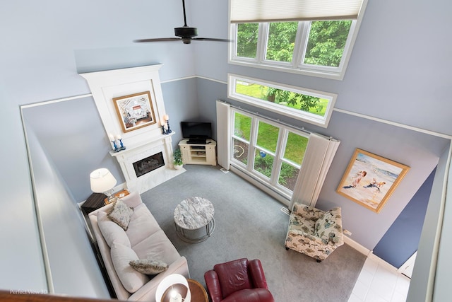 1860 Haverford Dr, Algonquin, IL 60102 - carpeted living area featuring ceiling fan, a premium fireplace, and a towering ceiling