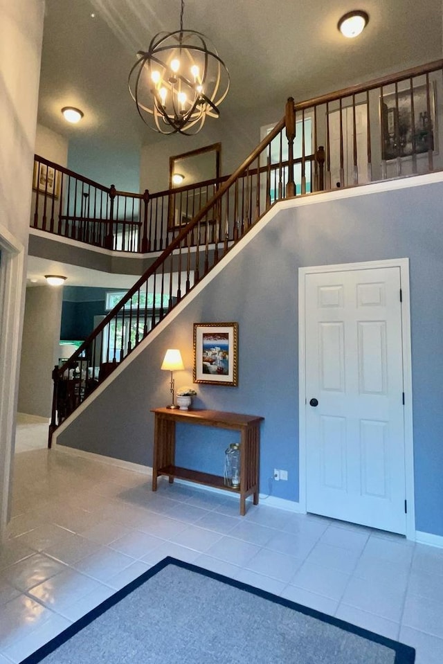 1860 Haverford Dr, Algonquin, IL 60102 - staircase featuring a chandelier, a high ceiling, and tile patterned floors