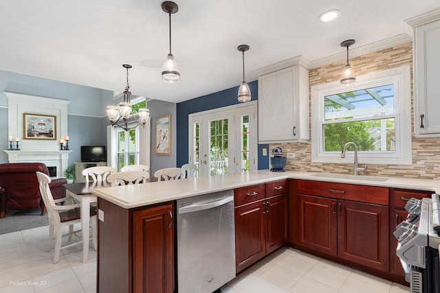 1860 Haverford Dr, Algonquin, IL 60102 - kitchen featuring dishwasher, light countertops, a peninsula, stove, and backsplash