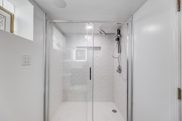 bathroom featuring a shower stall