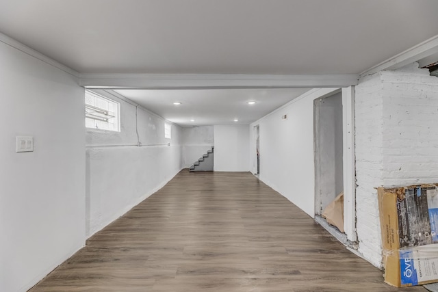 corridor featuring stairway, wood finished floors, and recessed lighting