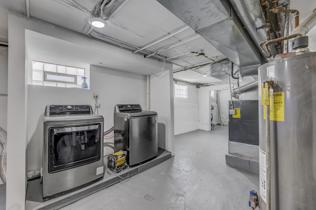 below grade area with gas water heater and separate washer and dryer