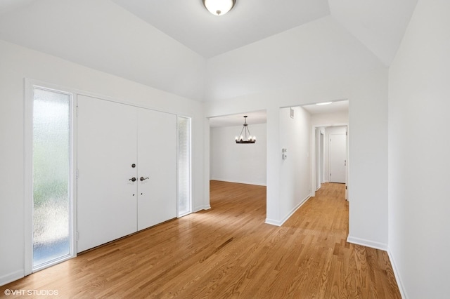 1770 Overland Trl, Deerfield, IL 60015 - entrance foyer with a chandelier, light wood finished floors, and vaulted ceiling