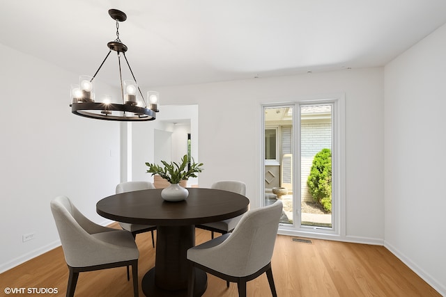 1770 Overland Trl, Deerfield, IL 60015 - dining space featuring a chandelier and light wood-type flooring