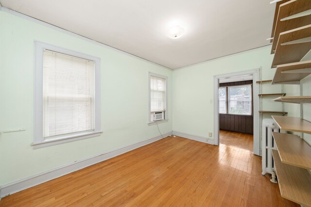 5010 N California Ave, Chicago, IL 60625 - spare room featuring light wood-style floors and cooling unit