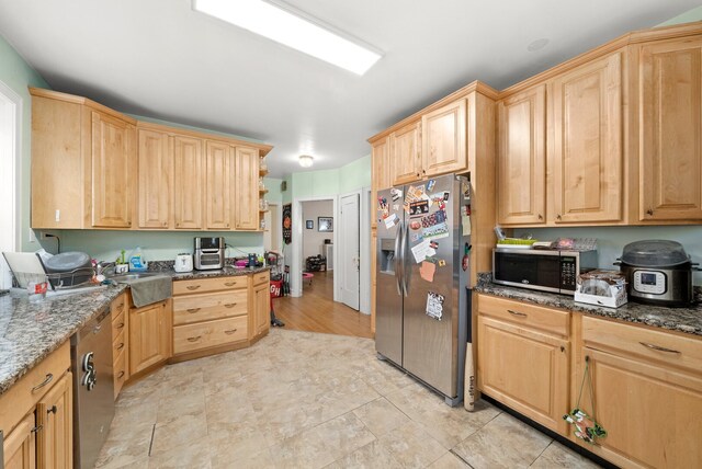 5010 N California Ave, Chicago, IL 60625 - kitchen with stainless steel appliances, light brown cabinets, and dark stone countertops