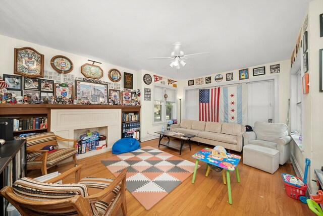 5010 N California Ave, Chicago, IL 60625 - living area with ceiling fan, wood finished floors, and a fireplace