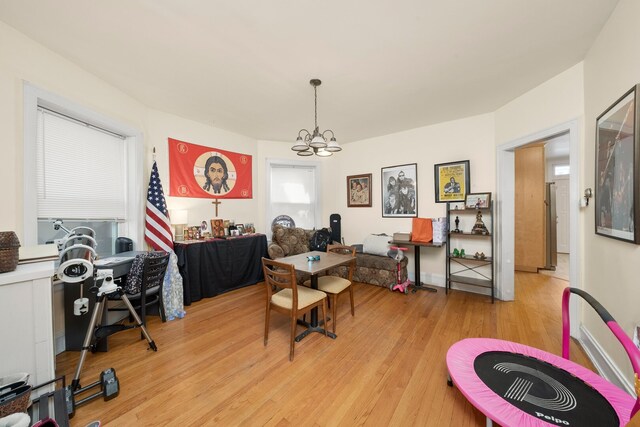 5010 N California Ave, Chicago, IL 60625 - dining area with a chandelier and light wood finished floors