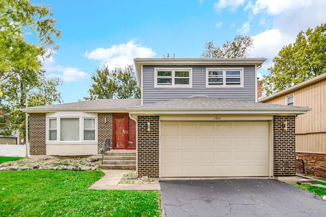 17804 Pebblewood Ln, Hazel Crest, IL 60429 - view of front of house featuring driveway, brick siding, a front lawn, and a shingled roof