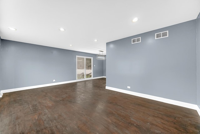 17804 Pebblewood Ln, Hazel Crest, IL 60429 - empty room featuring dark wood-style flooring, recessed lighting, and a chandelier