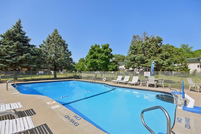 110 Meadowbrook Ln Unit 110, Morris, IL 60450 - community pool with a patio area and view of scattered trees