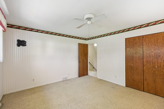 110 Meadowbrook Ln Unit 110, Morris, IL 60450 - unfurnished bedroom with carpet, a closet, and ceiling fan