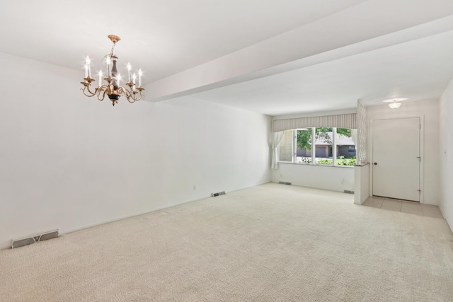 110 Meadowbrook Ln Unit 110, Morris, IL 60450 - spare room featuring a chandelier and light carpet