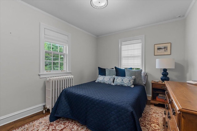 355 Myrtle St, Winnetka, IL 60093 - bedroom featuring radiator heating unit, wood finished floors, and crown molding