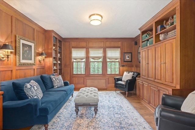 355 Myrtle St, Winnetka, IL 60093 - living room featuring light wood finished floors, wood walls, and built in shelves