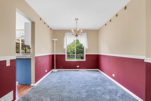 768 Fieldstone Dr, Lake Villa, IL 60046 - carpeted empty room with a chandelier and baseboards