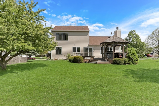 768 Fieldstone Dr, Lake Villa, IL 60046 - back of house with a gazebo, a chimney, a yard, and a deck