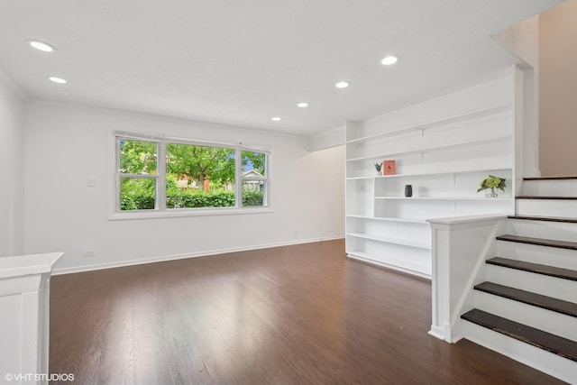2208 Foster St Unit A, Evanston, IL 60201 - unfurnished living room featuring dark wood-type flooring, recessed lighting, stairs, built in shelves, and ornamental molding