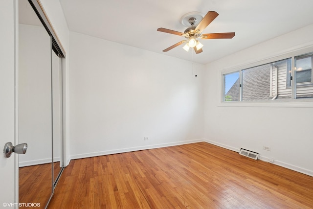 2208 Foster St Unit A, Evanston, IL 60201 - unfurnished bedroom with wood finished floors, a closet, and ceiling fan