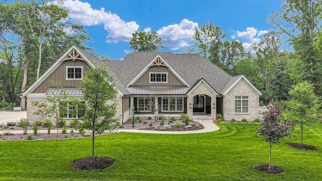 2611 Private Access 424, Mahomet, IL 61853 - craftsman inspired home featuring stone siding, board and batten siding, a front yard, and covered porch