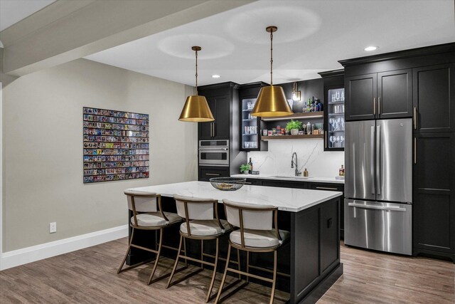 2611 Private Access 424, Mahomet, IL 61853 - kitchen featuring stainless steel appliances, a center island, open shelves, recessed lighting, and backsplash